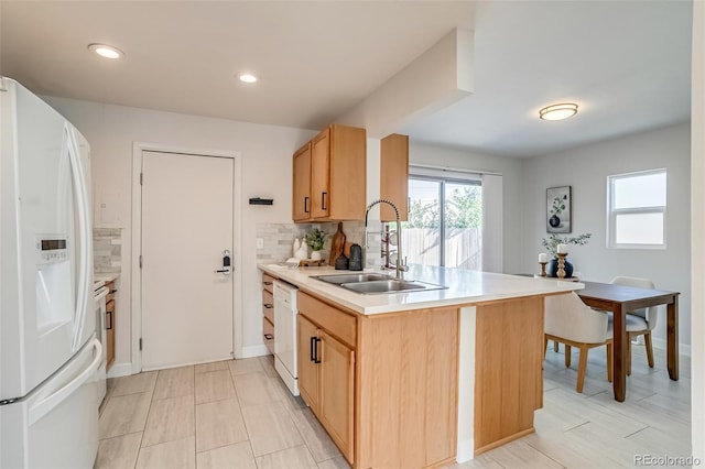 1060 Grove St, Denver, CO 80204 - kitchen featuring white appliances, light countertops, backsplash, light brown cabinets, and recessed lighting