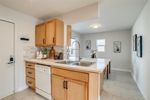 1060 Grove St, Denver, CO 80204 - kitchen with white dishwasher, light brown cabinets, a peninsula, and light countertops