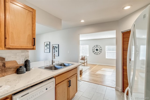 1060 Grove St, Denver, CO 80204 - kitchen with white appliances, recessed lighting, light brown cabinets, light tile patterned floors, and a peninsula