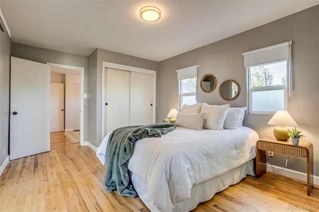 1060 Grove St, Denver, CO 80204 - bedroom featuring light wood-type flooring and a closet
