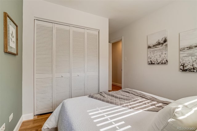 1060 Grove St, Denver, CO 80204 - bedroom featuring a closet and light wood finished floors
