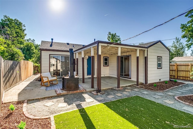1060 Grove St, Denver, CO 80204 - back of house with a patio and a fenced backyard