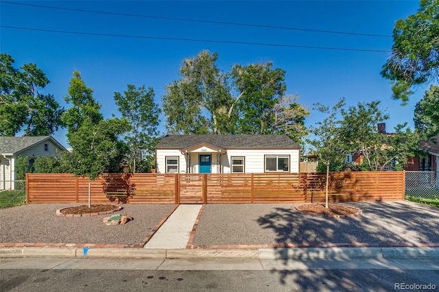 1060 Grove St, Denver, CO 80204 - view of front facade with a fenced front yard