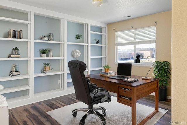 office featuring dark hardwood / wood-style flooring and a textured ceiling