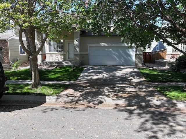 obstructed view of property with a garage