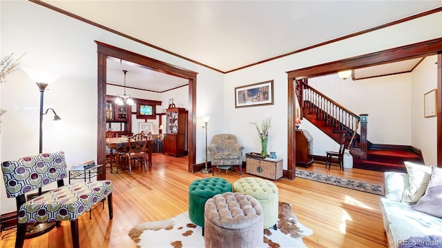 living room featuring hardwood / wood-style floors and crown molding