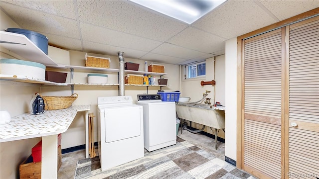 clothes washing area with independent washer and dryer