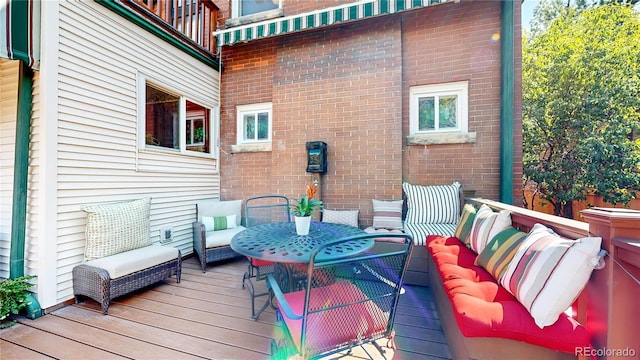 wooden deck with an outdoor hangout area