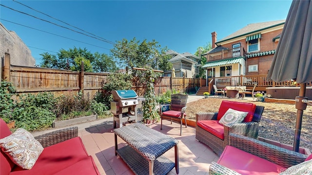 view of patio / terrace with an outdoor hangout area and grilling area