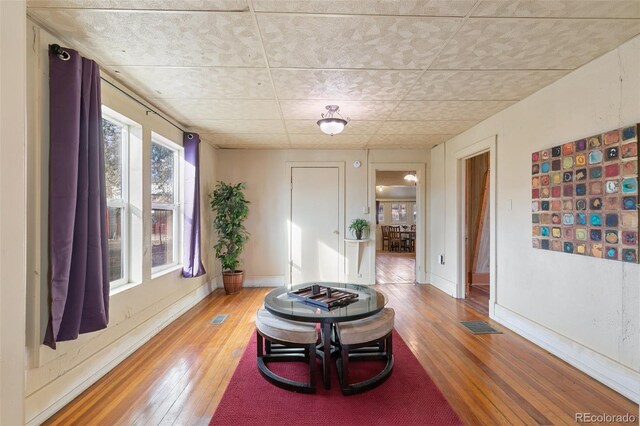 sitting room featuring hardwood / wood-style floors