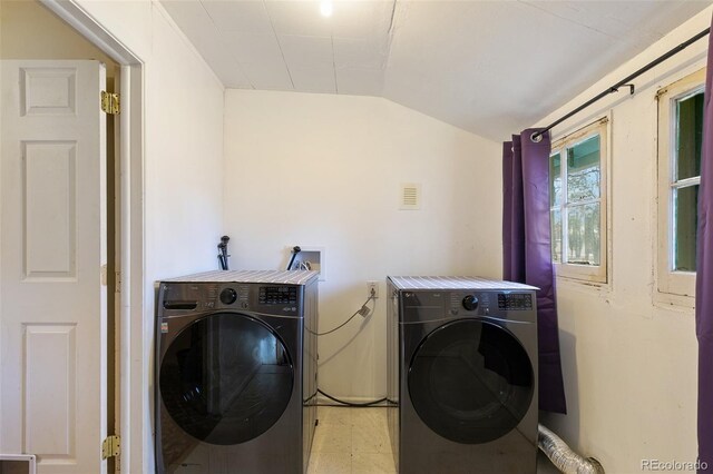 washroom with washer and dryer