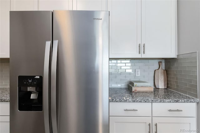 15700 E Jamison Dr Unit 305, Englewood, CO 80112 - kitchen with stainless steel fridge, tasteful backsplash, white cabinetry, and stone countertops