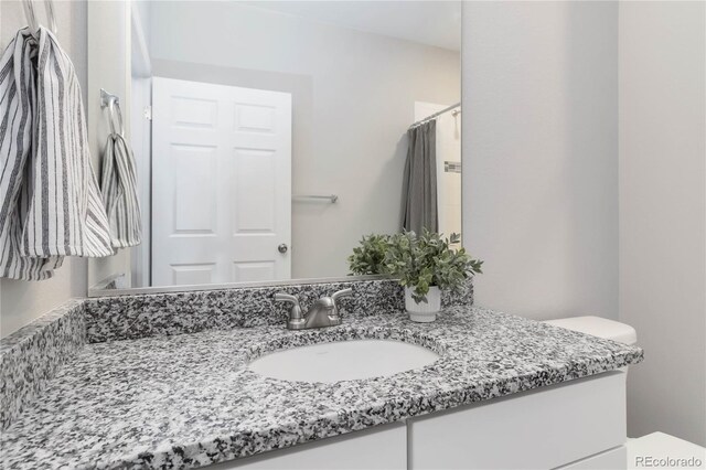 15700 E Jamison Dr Unit 305, Englewood, CO 80112 - bathroom featuring vanity and curtained shower