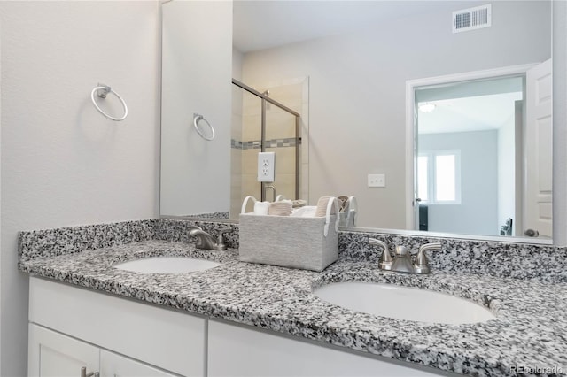 15700 E Jamison Dr Unit 305, Englewood, CO 80112 - bathroom with double vanity and a stall shower