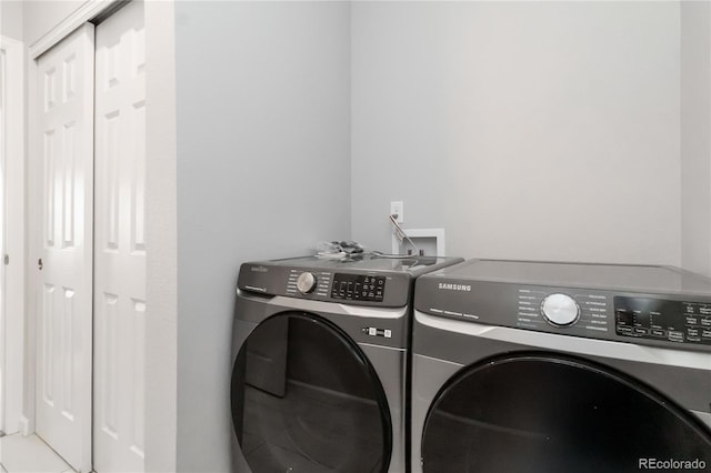 15700 E Jamison Dr Unit 305, Englewood, CO 80112 - laundry room with washer and dryer and tile patterned floors