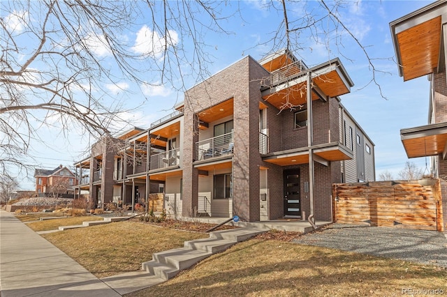 view of front of home with brick siding