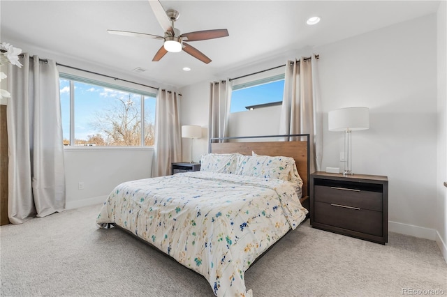 carpeted bedroom featuring a ceiling fan, recessed lighting, multiple windows, and baseboards