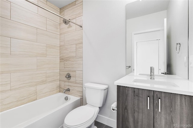 full bath with bathtub / shower combination, baseboards, vanity, and toilet