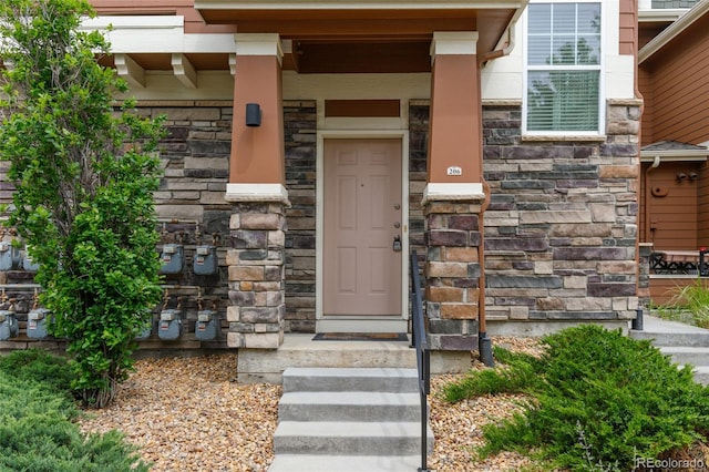 7130 Simms St Unit 206, Arvada, CO 80004 - view of exterior entry featuring stone siding