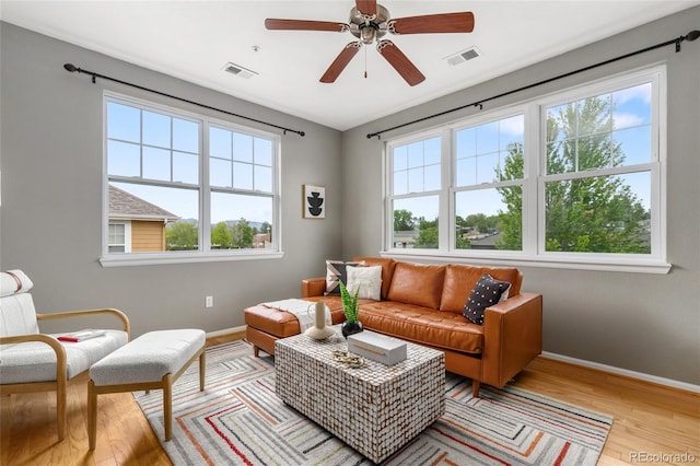 7130 Simms St Unit 206, Arvada, CO 80004 - living room with plenty of natural light, light wood-type flooring, and baseboards