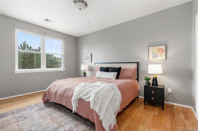 7130 Simms St Unit 206, Arvada, CO 80004 - bedroom with wood finished floors and baseboards