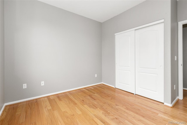 7130 Simms St Unit 206, Arvada, CO 80004 - unfurnished bedroom with light wood-style flooring and a closet