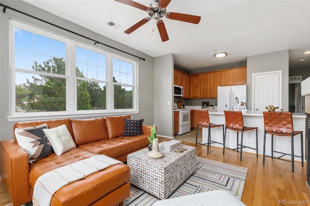 7130 Simms St Unit 206, Arvada, CO 80004 - living area with ceiling fan, light wood-style flooring, and recessed lighting