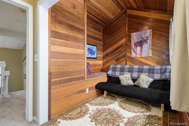 sitting room featuring vaulted ceiling, a sauna, wooden walls, and wooden ceiling