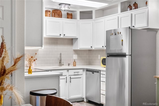 2985 W 46th Ave, Denver, CO 80211 - kitchen with appliances with stainless steel finishes, a sink, light countertops, and white cabinets