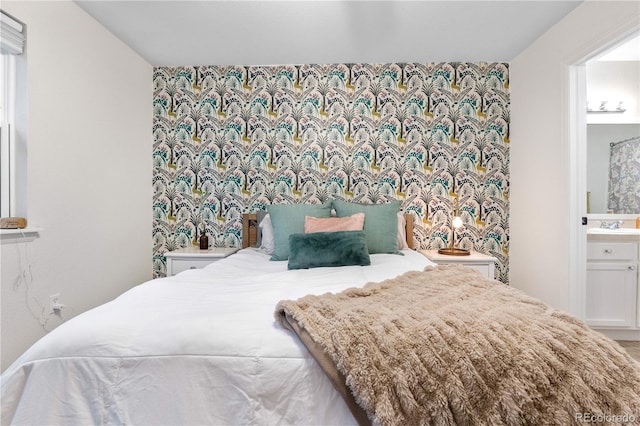 2985 W 46th Ave, Denver, CO 80211 - bedroom with wallpapered walls, an accent wall, and a sink