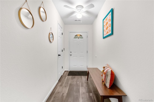 2985 W 46th Ave, Denver, CO 80211 - doorway with wood finished floors, a ceiling fan, and baseboards