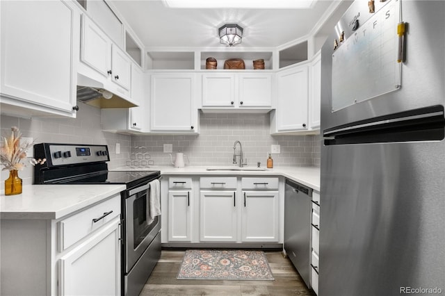 2985 W 46th Ave, Denver, CO 80211 - kitchen with appliances with stainless steel finishes, under cabinet range hood, and white cabinets