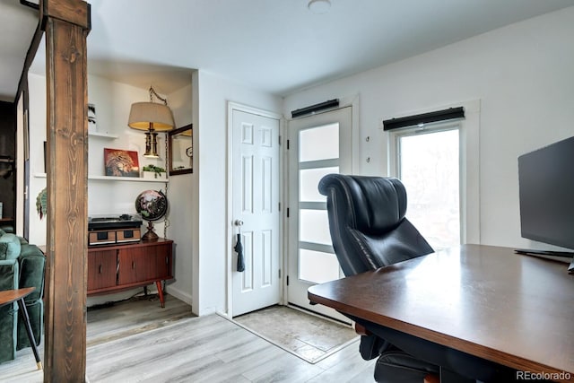 office space with light wood-type flooring