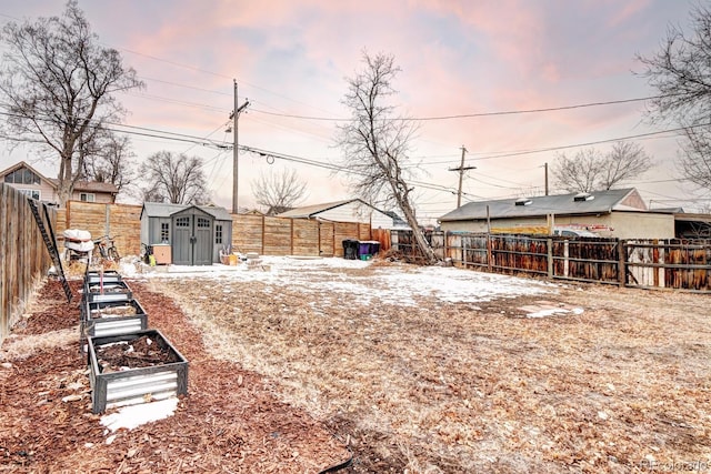 yard at dusk featuring a shed