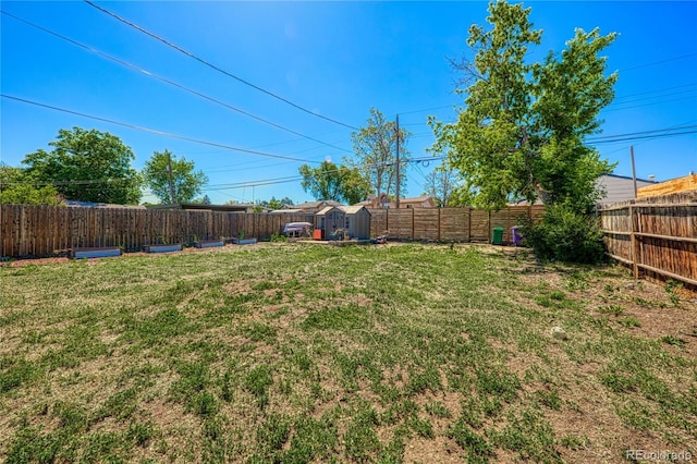 2852 W Ellsworth Ave, Denver, CO 80219 - fenced backyard featuring a storage unit