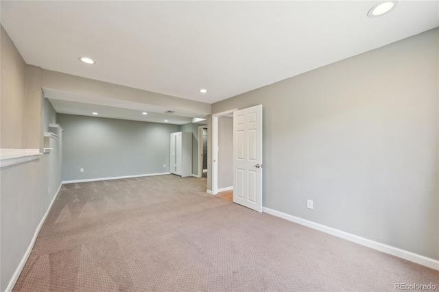 carpeted empty room with recessed lighting and baseboards