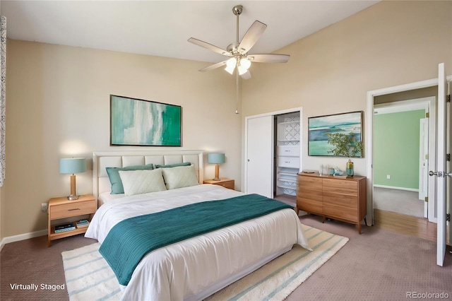 bedroom with carpet floors, baseboards, ceiling fan, and a closet