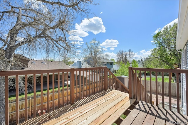 wooden terrace featuring fence