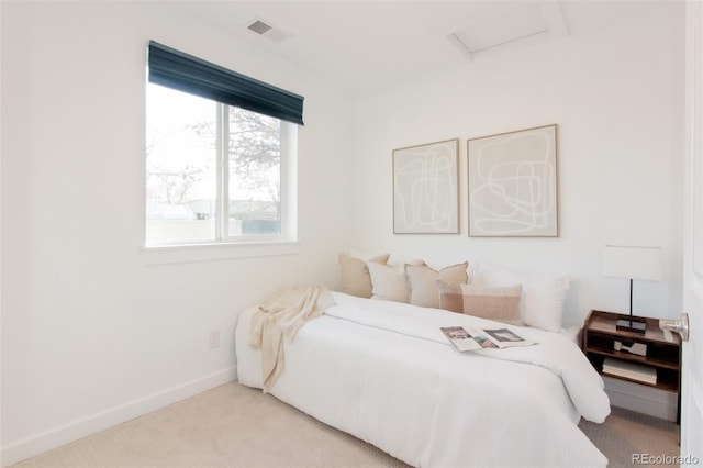 carpeted bedroom with attic access, visible vents, and baseboards