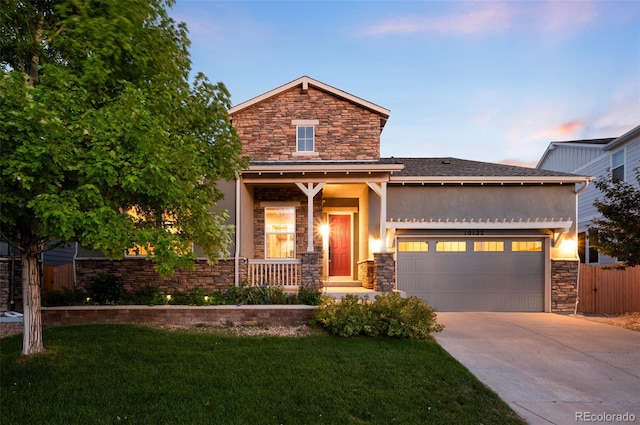 10122 Des Moines St, Parker, CO 80134 - view of front of house with stone siding, a garage, concrete driveway, stucco siding, and a porch