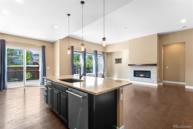 10122 Des Moines St, Parker, CO 80134 - kitchen featuring stainless steel dishwasher, dark wood finished floors, plenty of natural light, and recessed lighting