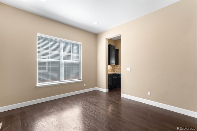 10122 Des Moines St, Parker, CO 80134 - spare room with dark wood-style floors and recessed lighting