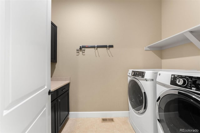 10122 Des Moines St, Parker, CO 80134 - laundry area featuring separate washer and dryer, cabinet space, and light tile patterned flooring