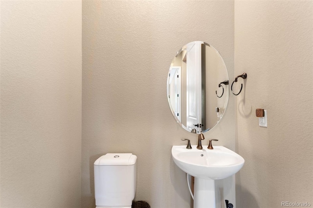 10122 Des Moines St, Parker, CO 80134 - half bath with toilet and a textured wall
