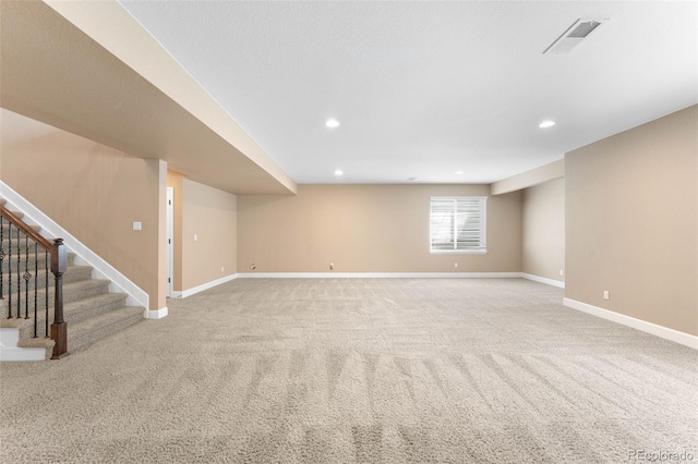 10122 Des Moines St, Parker, CO 80134 - below grade area with light carpet, stairs, and recessed lighting