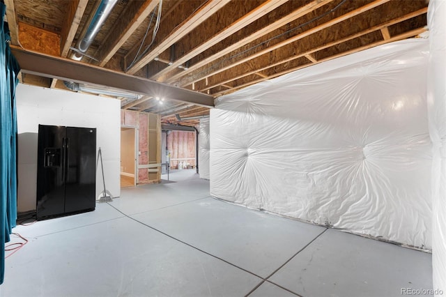 10122 Des Moines St, Parker, CO 80134 - unfinished below grade area featuring black fridge