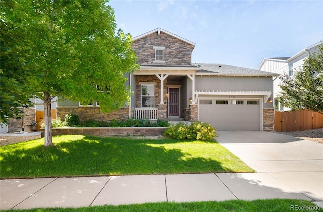10122 Des Moines St, Parker, CO 80134 - craftsman-style house with stone siding, an attached garage, driveway, stucco siding, and covered porch