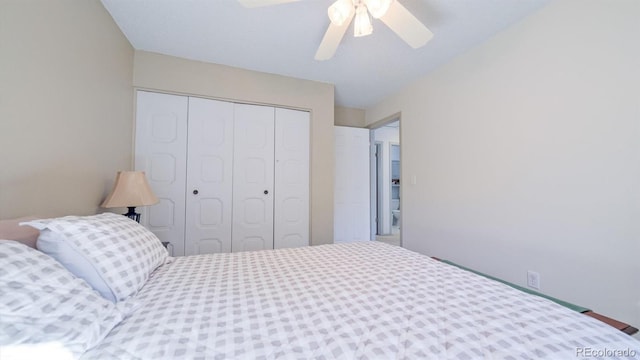 bedroom featuring ceiling fan and a closet