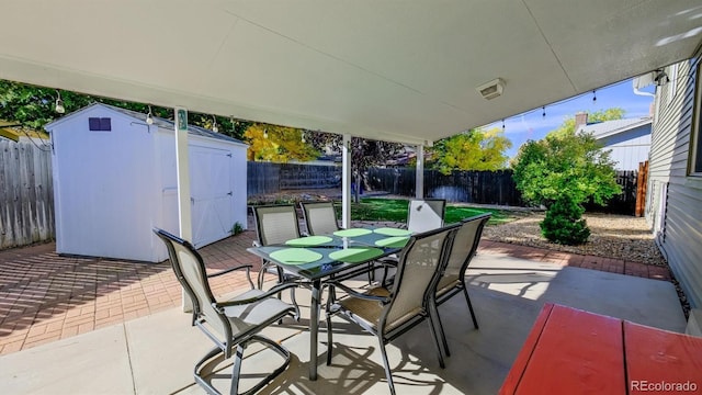 view of patio with a storage shed