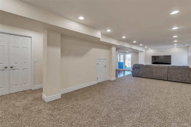 unfurnished living room with baseboards, carpet flooring, and recessed lighting